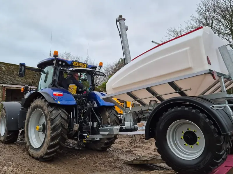 3T Easy-Feed trailer being pulled by tractor